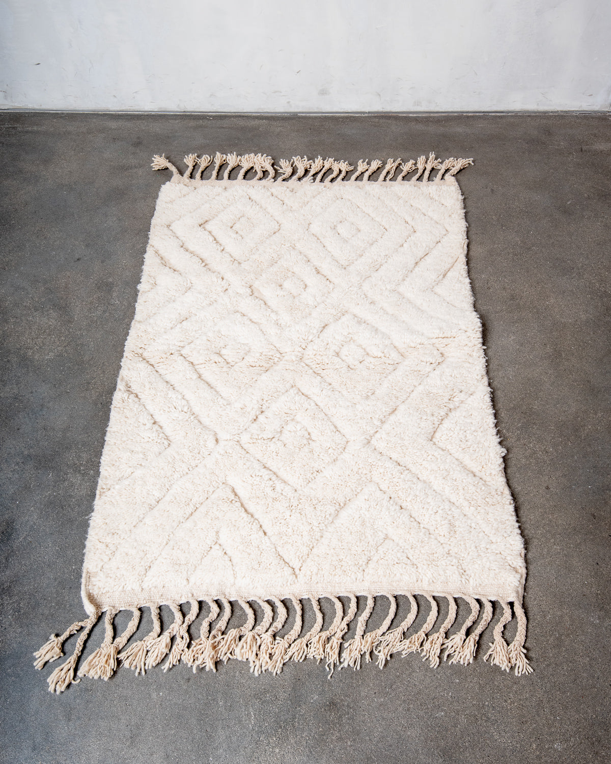 Modern, designer, handcrafted Berber rug from Morocco. Beniourain carpet with minimalist design, natural wool pile and a fluffy texture.